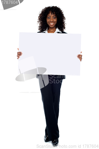 Image of Corporate woman displaying white ad board