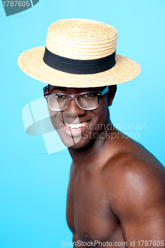 Image of Studio portrait of young man with hat and eyewear