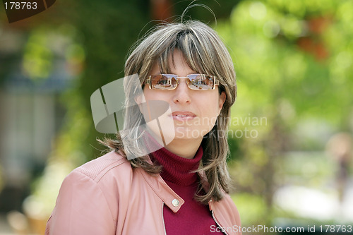 Image of Happy woman in the park