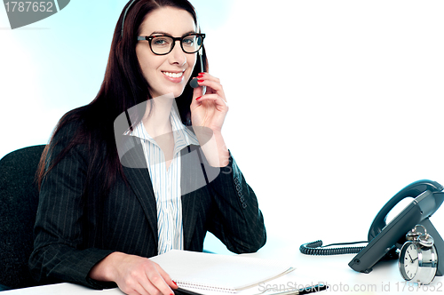 Image of Female customer care executive holding mic