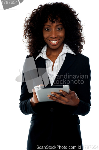 Image of Young businesswoman using wireless tablet pc