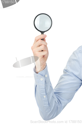 Image of  hand holding magnifying glass