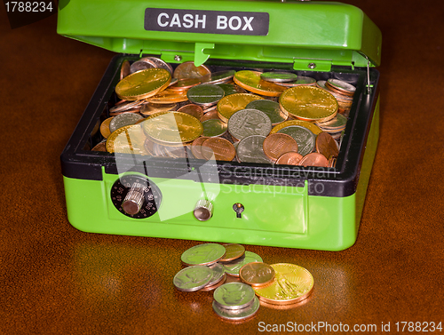 Image of Green cash box with gold and silver coins