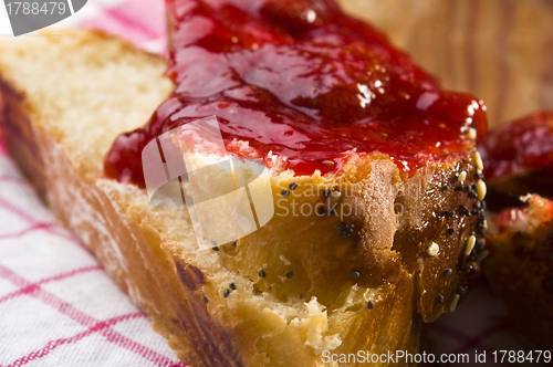 Image of Sweet bread ( challah ) with strawberry jam