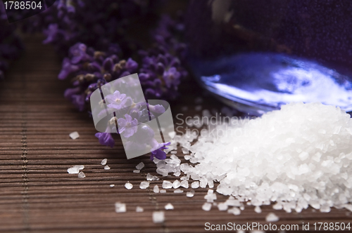 Image of Lavender flowers and the bath salt and essential oil