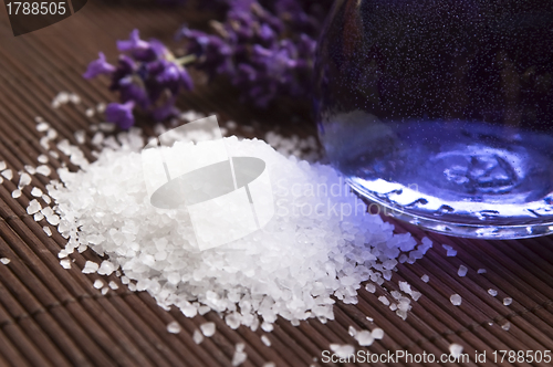 Image of Lavender flowers and the bath salt and essential oil