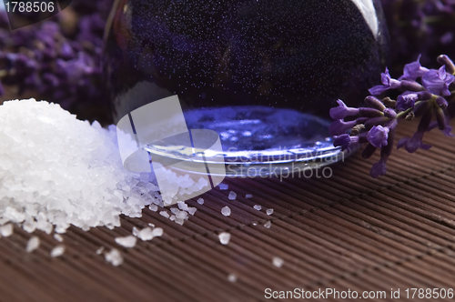 Image of Lavender flowers and the bath salt and essential oil