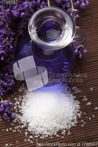 Image of Lavender flowers and the bath salt and essential oil