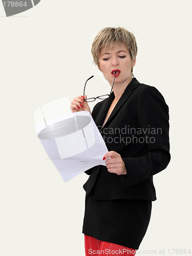 Image of Businesswoman reading a paper