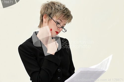 Image of Businesswoman reading a paper