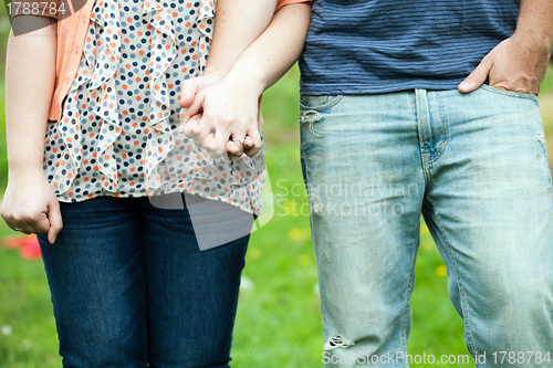 Image of Cute Couple Holding Hands