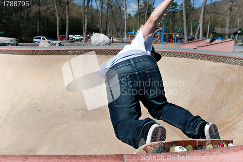 Image of Skateboarder Skating Inside the Bowl