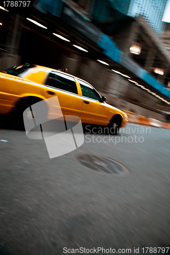 Image of Speeding Yellow City Taxi Cab