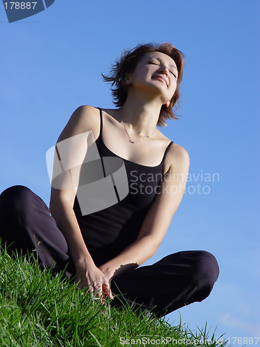 Image of Young woman enjoying life outdoor