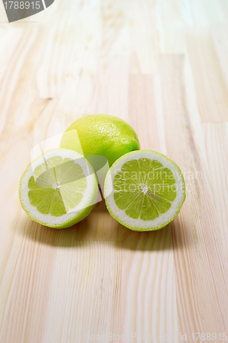 Image of fresh lemon  over pinewood table