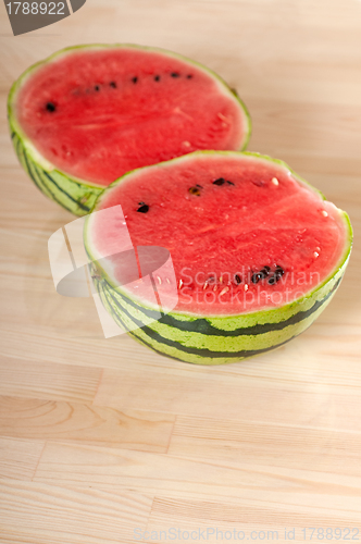 Image of fresh watermelon on a  wood table