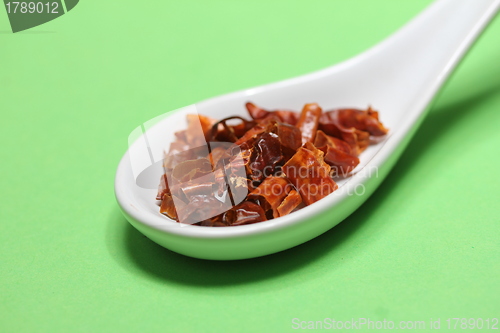 Image of hot chili plant pieces on a spoon