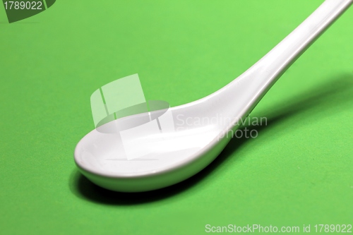 Image of plain white porcelain spoon