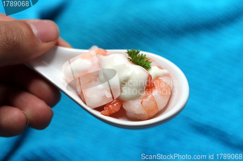 Image of tasty fresh shrimps on a spoon