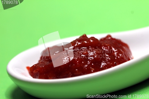 Image of hot sauce on a spoon