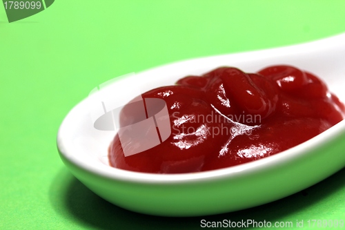 Image of ketchup on a porcelain spoon