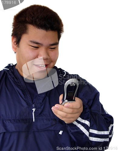 Image of Asian teenage boy with phone
