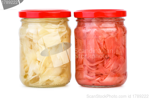 Image of Glass jars with white and pink marinated sliced ginger roots