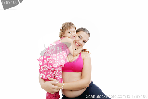 Image of Beautiful pregnant woman with her daughter. Isolated on white ba