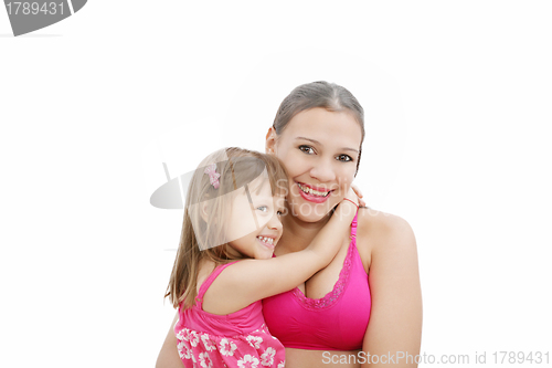 Image of Portrait of Hispanic pregnant woman with daughter isolated over 