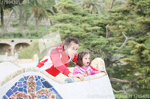 Image of Father and daughter with a surprised looking in a big balcony