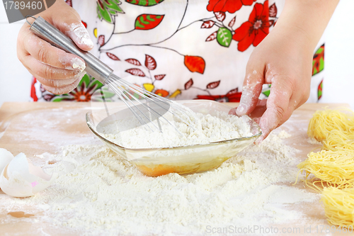 Image of Woman mixing dough