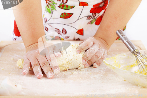 Image of Woman kneading dough