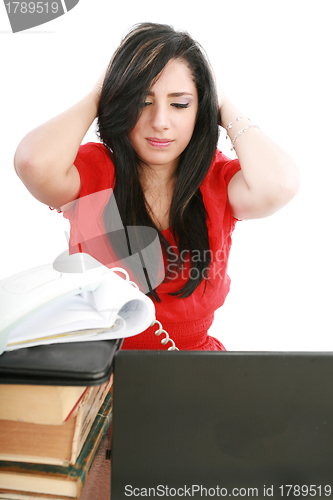 Image of Young tired business woman with headache sitting at computer in 