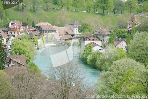 Image of Stunning view of a beautiful town around the lake during the sum