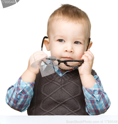 Image of Portrait of a cute little boy wearing glasses