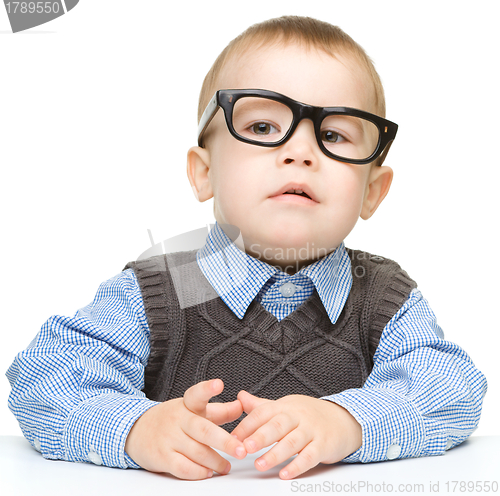Image of Portrait of a cute little boy wearing glasses