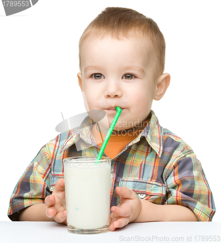 Image of Cute little boy with a glass of milk