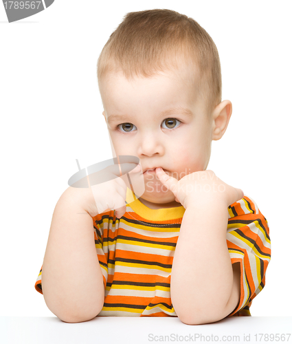 Image of Portrait of a cute and pensive little boy