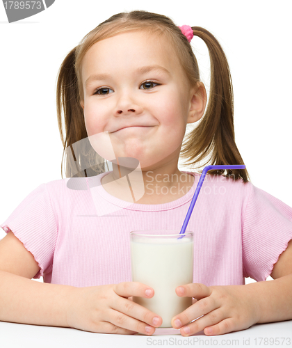 Image of Cute little girl with a glass of milk