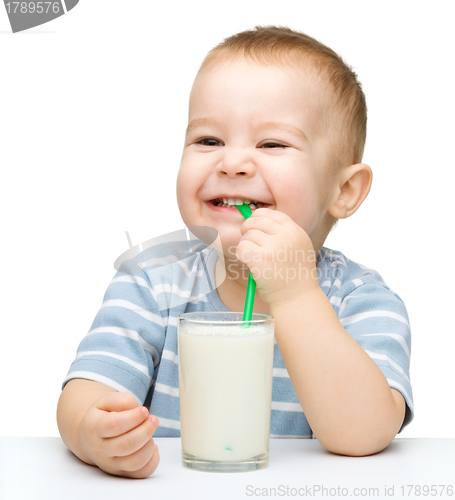 Image of Cute little boy with a glass of milk