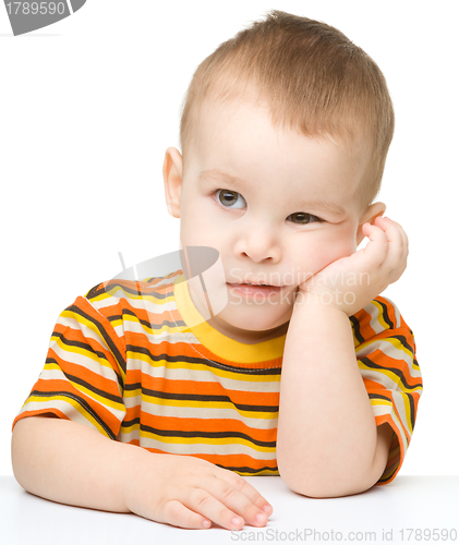 Image of Portrait of a cute and pensive little boy