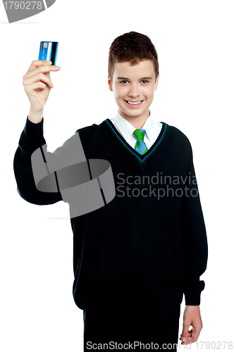 Image of School boy holding credit card