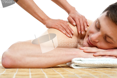 Image of Handsome male getting spa massage