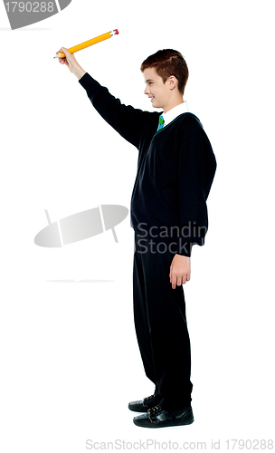 Image of School boy drawing imaginary diagram