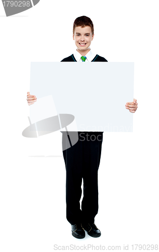 Image of Young boy showing blank billboard