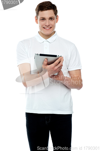 Image of Casual teen operating touch screen device