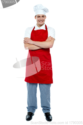 Image of Handsome young cook posing in uniform