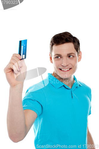 Image of Handsome young man holding credit card