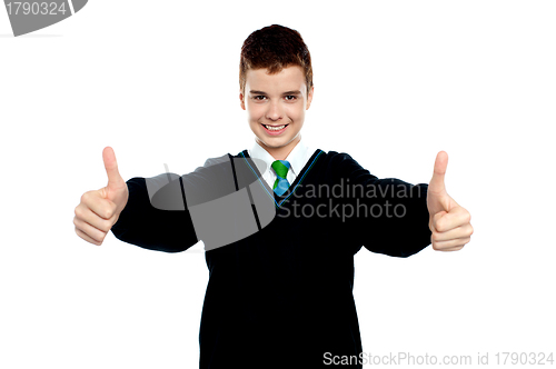 Image of Cute kid showing double thumbs up to camera