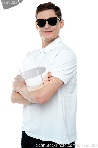 Image of Casual young man posing with crossed arms